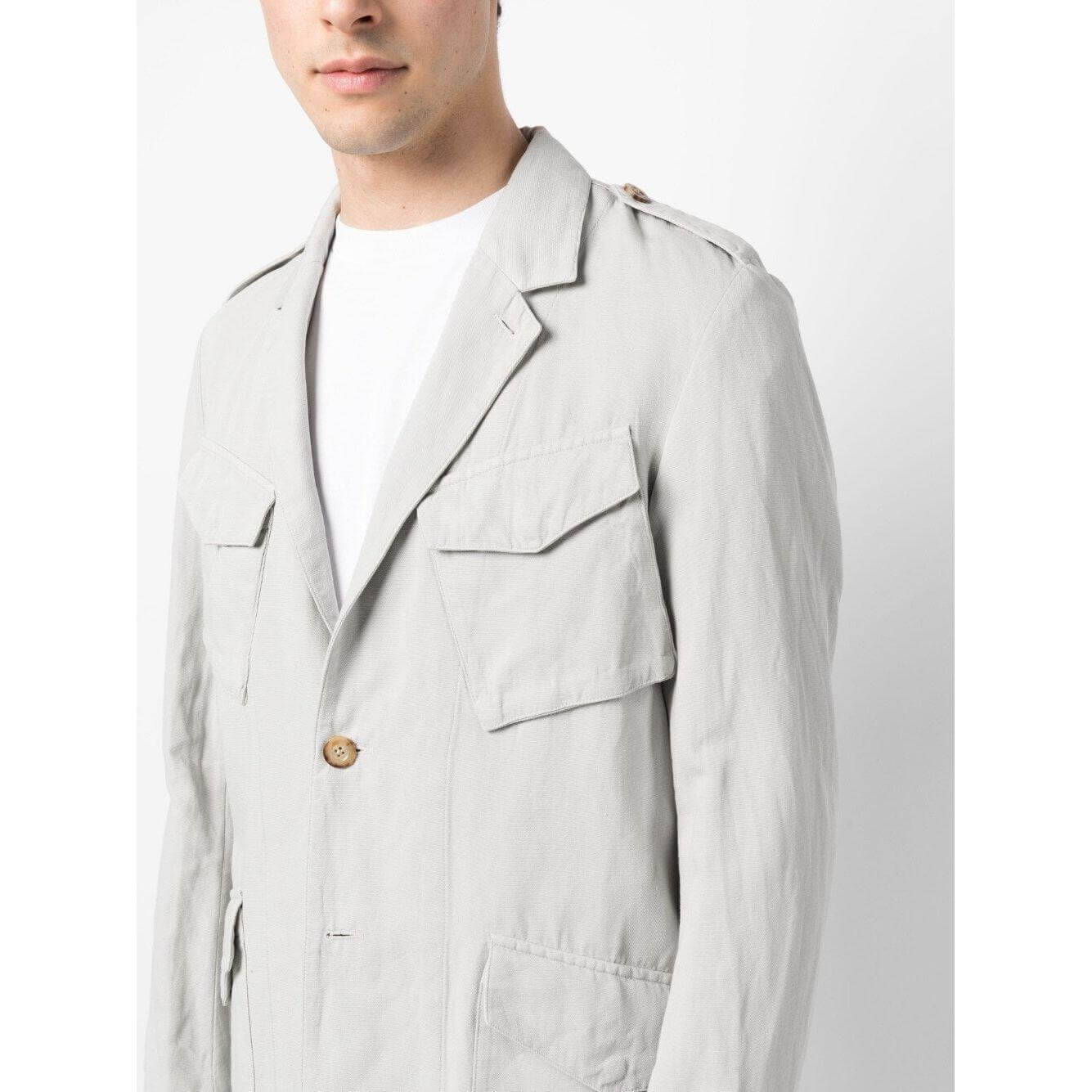 Man wearing Boglioli white jacket with notched lapels and pocket details, cotton-linen blend, stylish men's casual outfit.