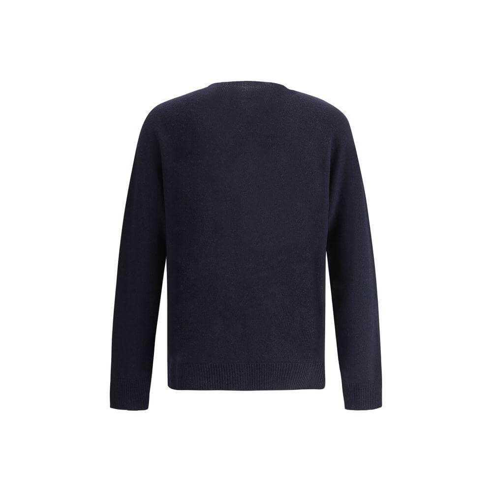 Jil Sander virgin wool seamless sweater, monochrome with ribbed crew neck, cuffs, and hem, shown in a regular fit from the back view.