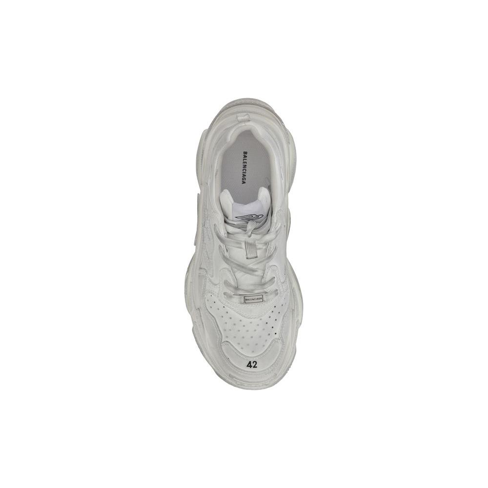 Top view of Balenciaga Triple S sneaker in white with embroidered size, woven panels, and platform sole. Stylish, comfortable design.