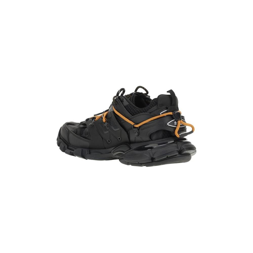 Balenciaga Track Trail Laces Sneakers in black with orange accents, featuring embossed logos for a distinctive look.