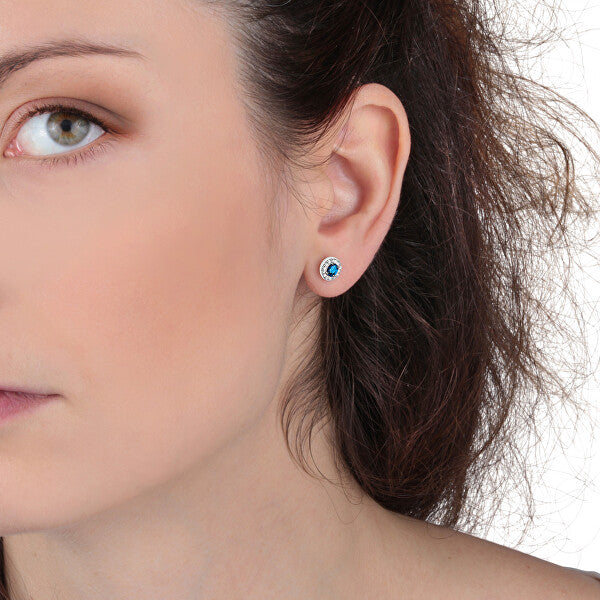 Woman wearing LA PETITE STORY JEWELRY Mod. LPS02ARQ15 earrings showcasing elegant blue gemstone design
