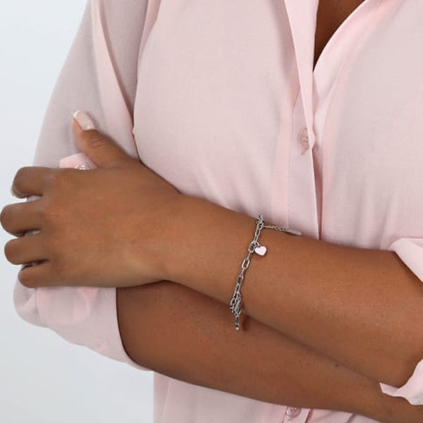 Woman wearing LA PETITE STORY JEWELRY Mod. LPS05ASF56 bracelet, stylishly paired with a light pink blouse.