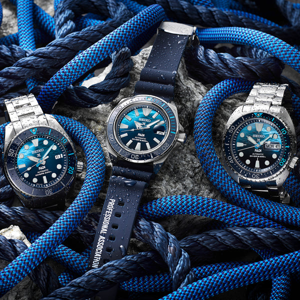SEIKO MOD. SRPJ93K1 watches displayed among blue ropes, highlighting design and features.