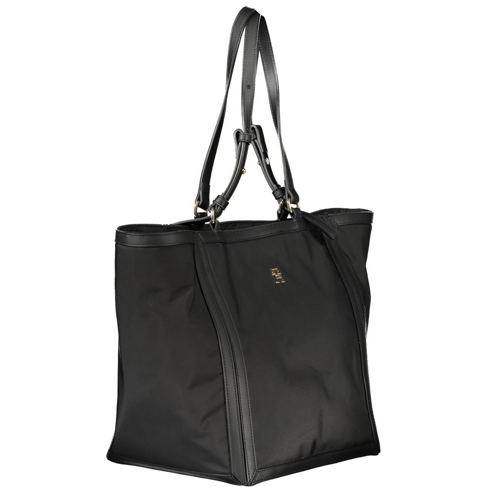 Tommy Hilfiger Black Polyester Handbag with adjustable strap, internal pocket, contrasting details, and zip closure.