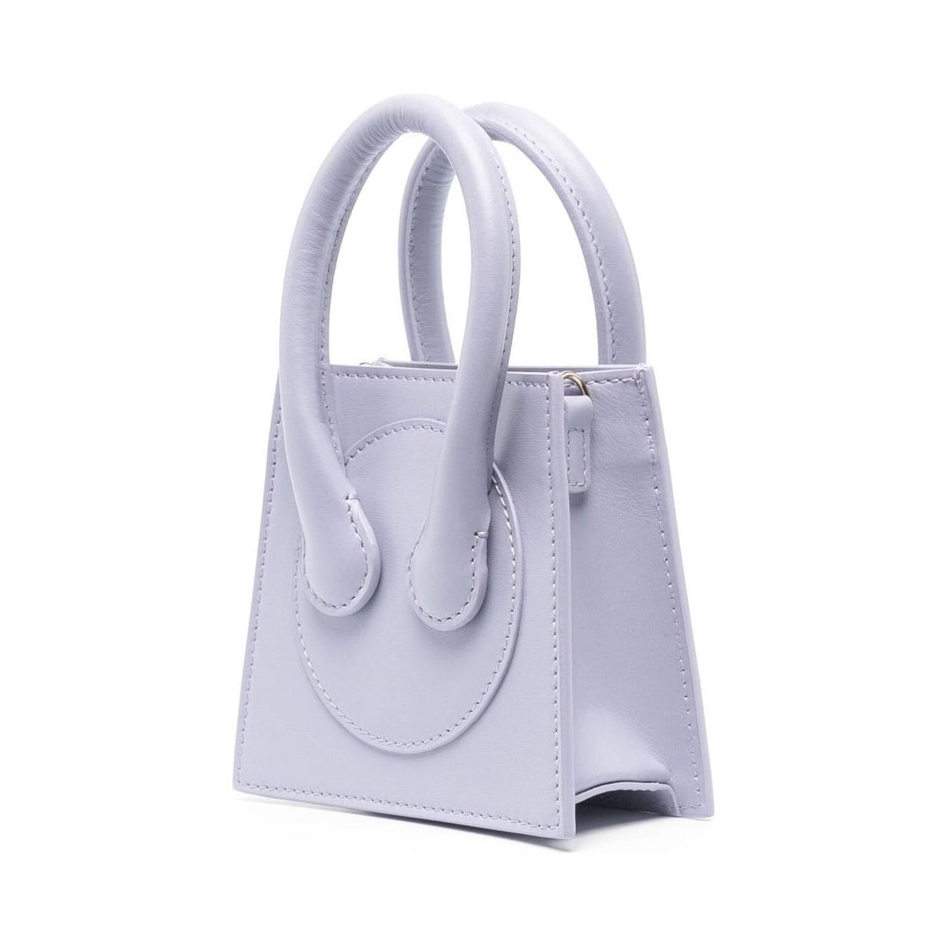 Front view with bag zipped and handles upright.