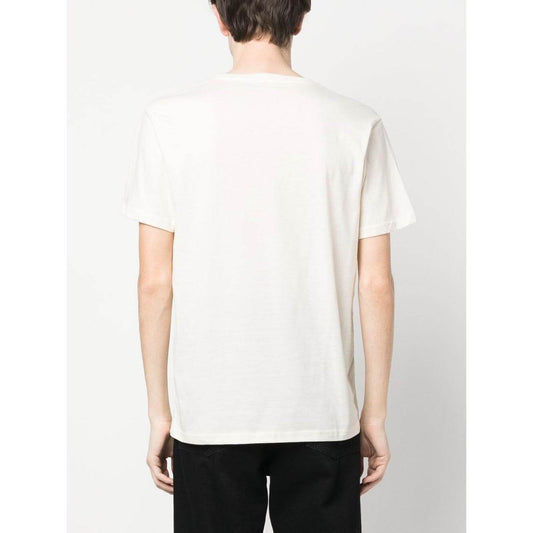 Back view of person wearing off-white COTOPAXI graphic-print organic cotton T-shirt with short sleeves and round neck.
