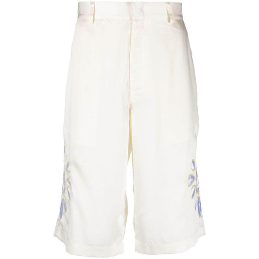Cream white embroidered satin shorts by BLUEMARBLE with knee-length design and belt loops.