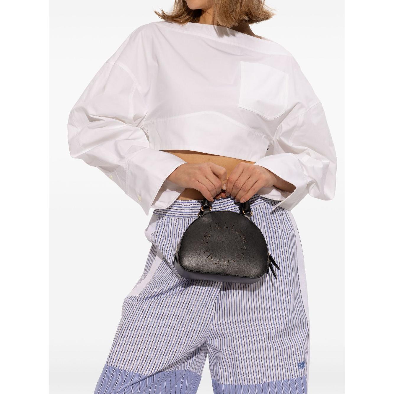 Front view with bag zipped and handles upright.