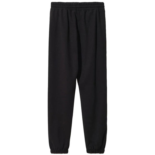 Comme Des Fuckdown black cotton sweatpants with drawstring waist and side pockets, featuring logo print on front and sides.
