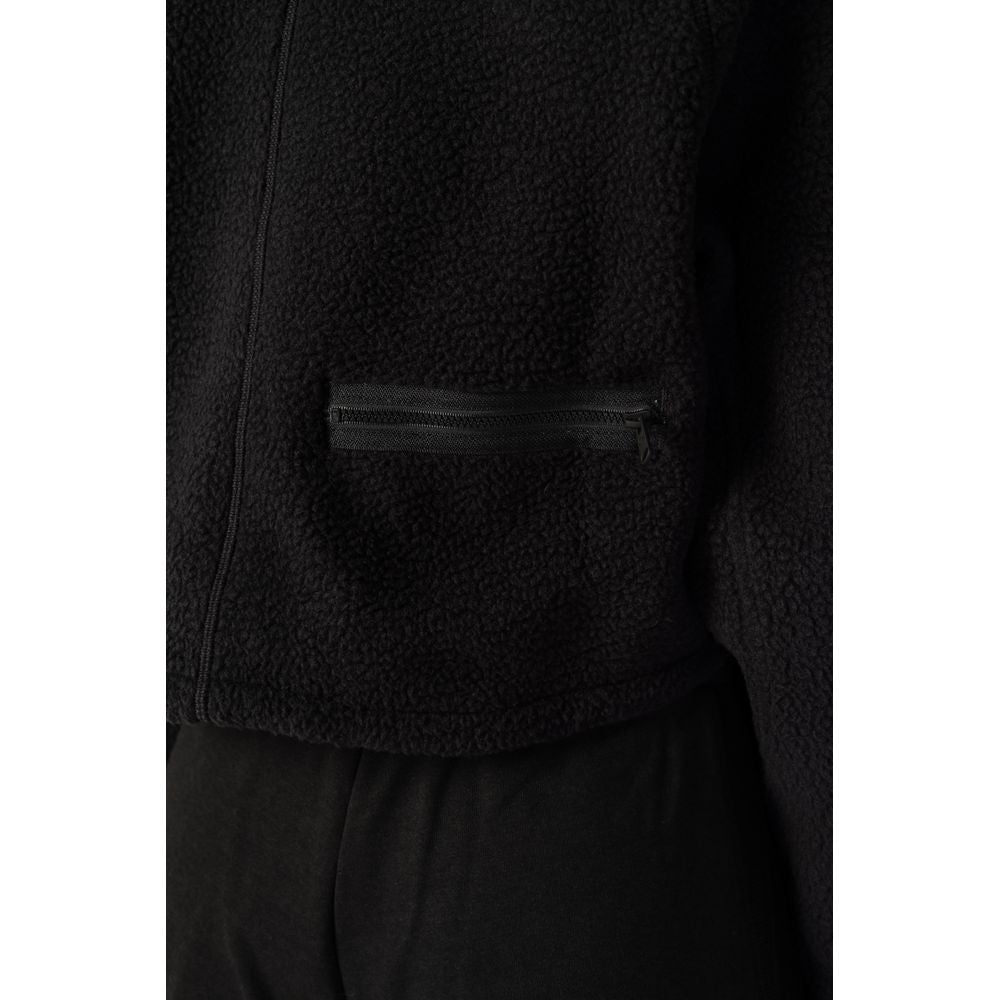 Front view with bag zipped and handles upright.