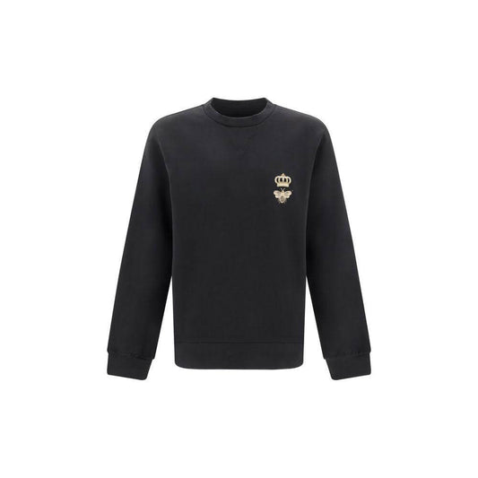 Dolce & Gabbana black sweatshirt with crown-embroidered bee, featuring ribbed cuffs and hem for a stylish and comfortable fit.