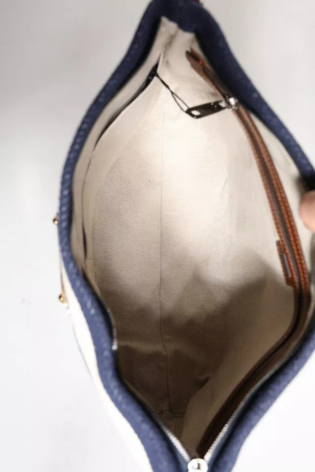 Front view with bag zipped and handles upright.