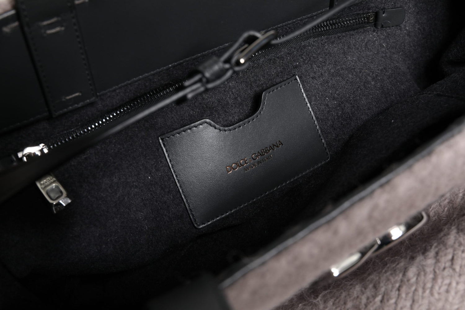 Front view with bag zipped and handles upright.