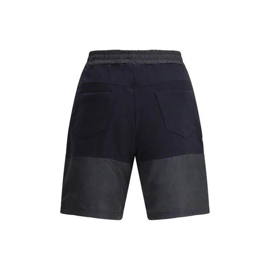 GCDS Tracksuit Shorts in black featuring adjustable waistband, side and back pockets, and contrasting monogram bands for a trendy look.