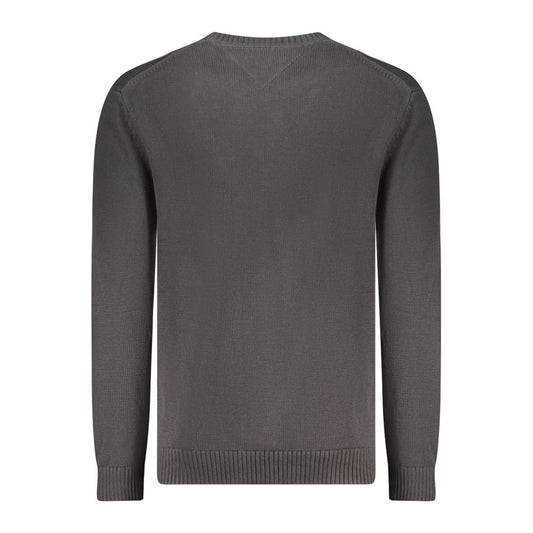 Back view of Tommy Hilfiger black cotton men's sweater showing crew neck and ribbed cuffs.