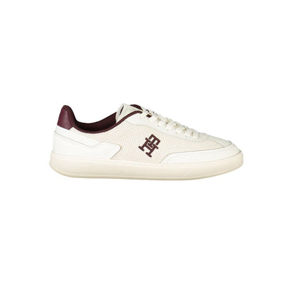 Tommy Hilfiger Beige Leather Women Sneaker with brown accents and logo embroidery, showcasing chic style and comfort for fashion enthusiasts.