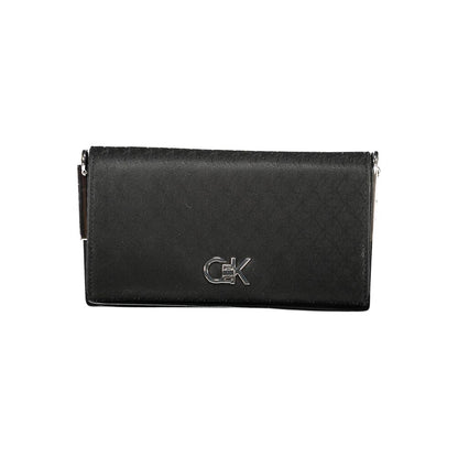 Calvin Klein Black Polyester Women Handbag with logo, chic accessory with spacious compartments and elegant twist closure.