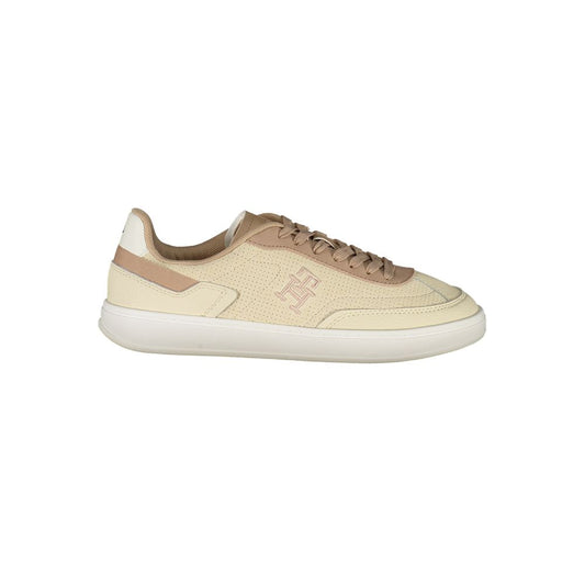 Tommy Hilfiger Beige Leather Women Sneaker featuring chic aesthetic and iconic logo embroidery on a versatile beige palette.