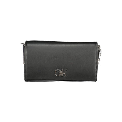 Calvin Klein Black Polyester Handbag with adjustable shoulder strap, contrasting details, and twist closure. Logo on front.