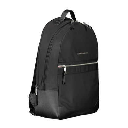 Tommy Hilfiger Black Polyester Backpack with adjustable straps, external pocket, and laptop compartment, featuring logo and zip closure.