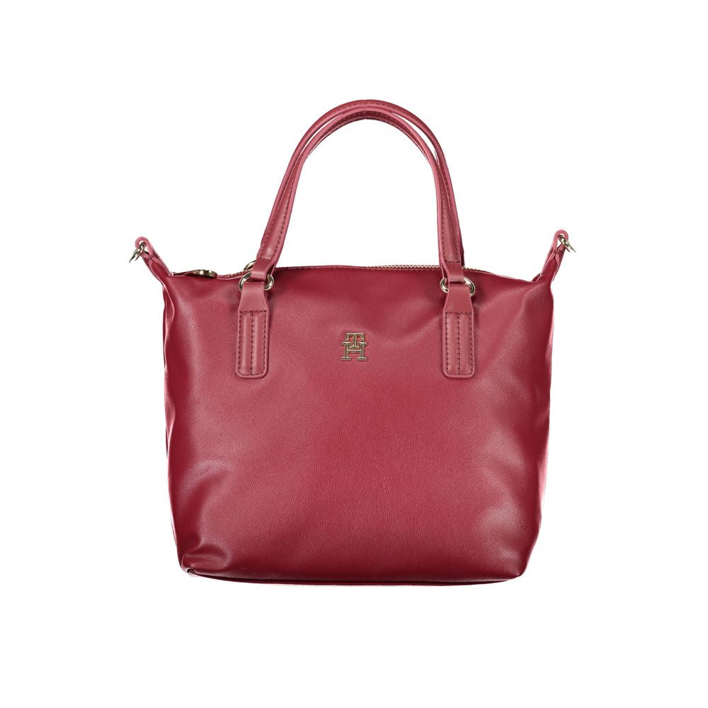 Tommy Hilfiger Red Polyester Handbag with two handles, adjustable strap, internal pocket, zip closure, and logo imprint.