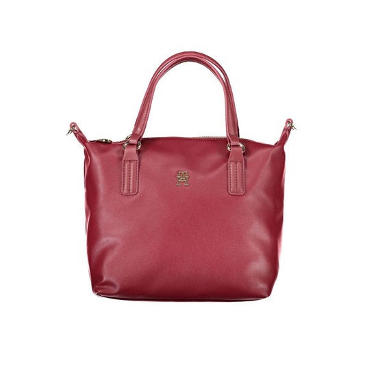 Tommy Hilfiger Red Polyester Handbag with two handles, adjustable and removable shoulder strap, internal pocket, zip closure and logo.