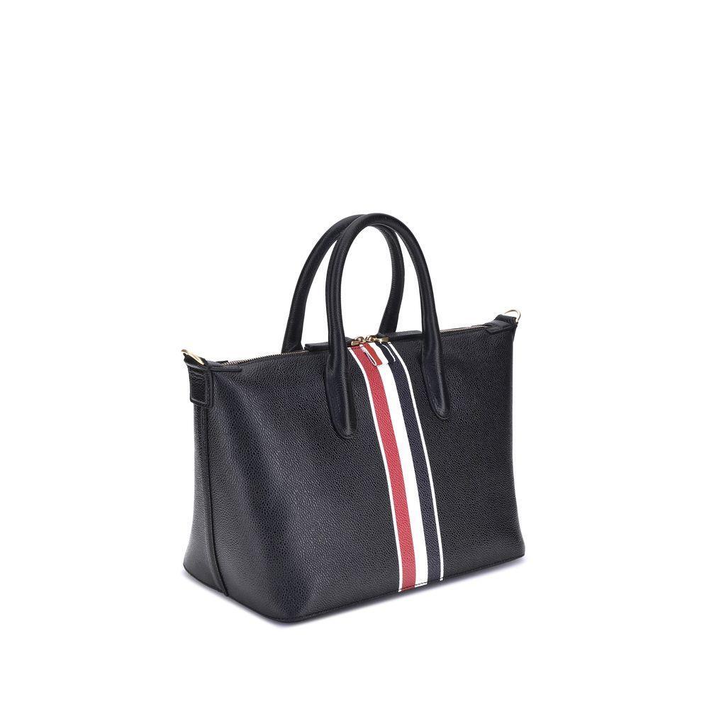 Front view with bag zipped and handles upright.