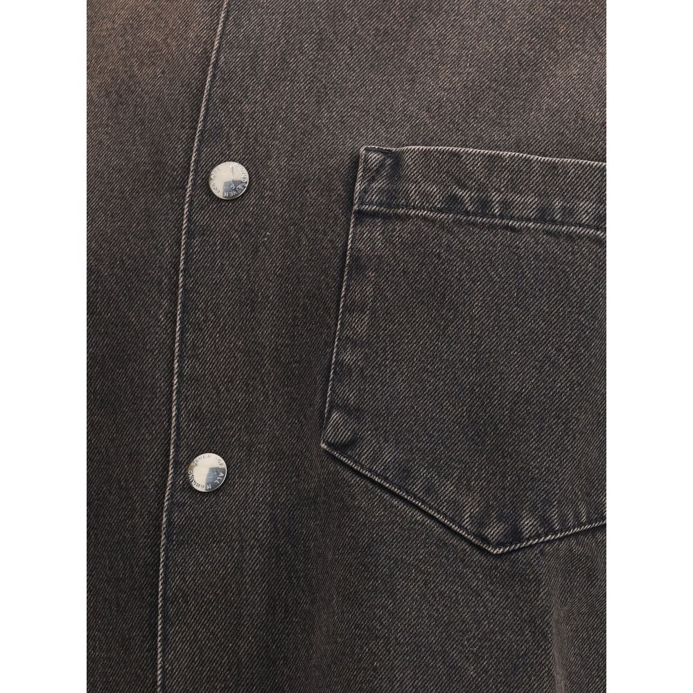 Close-up of 7FOR Black Cotton Denim Jacket showcasing front button closure and patch pocket detail for a relaxed, edgy style.