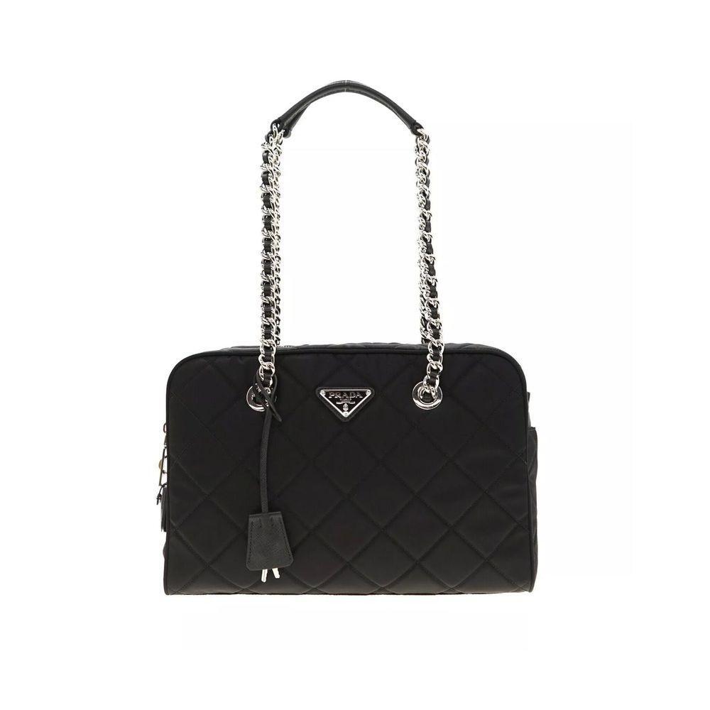 Front view with bag zipped and handles upright.
