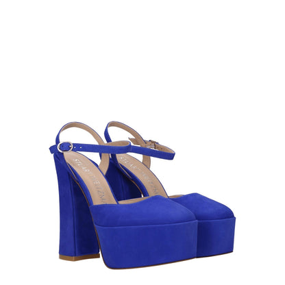 Stuart Weitzman Blue Leather Platform Sandals with high heel and buckle closure, featuring suede material and gold accents.