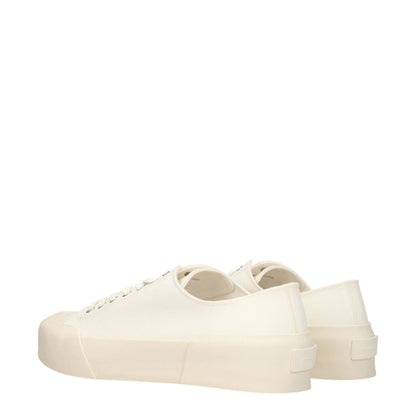 Jil Sander Beige Fabric Low Top Sneakers with round toe, lace-up closure, rubber sole, and back logo detail in sporty glam style.