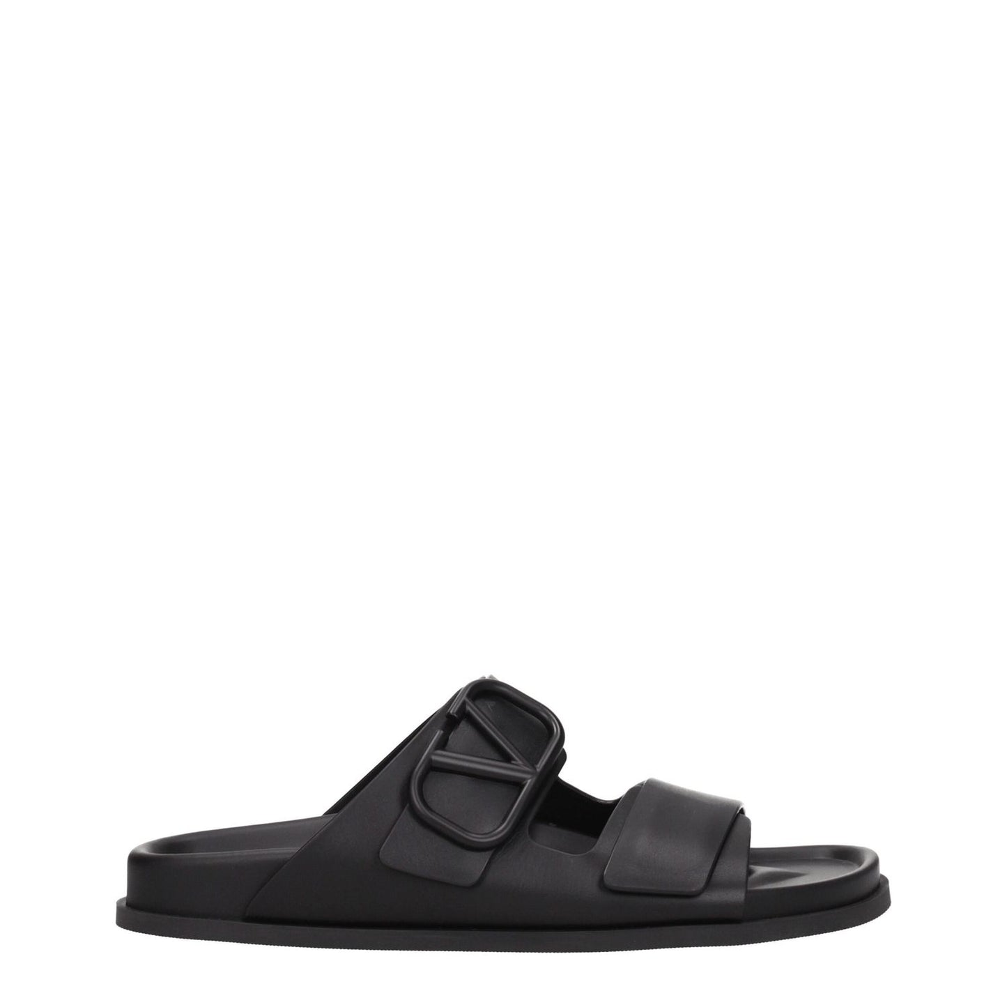 Valentino Garavani Black Leather Slippers with open toe and rubber sole, featuring a front logo design and low flat heel.