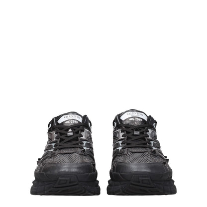 Valentino Garavani Black Fabric Athletic Sneakers with studs, logos, lace-up closure, and mid heel for casual style.