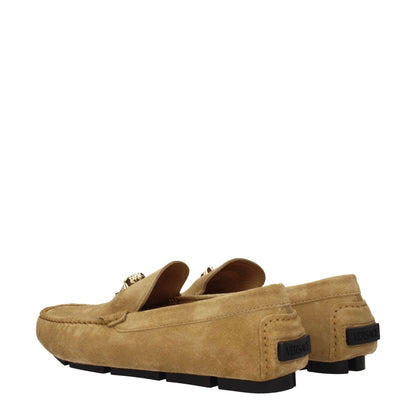 Versace Beige Leather Slip-On Loafers with gold logo, suede material, and leather sole, featuring a casual style with round toe and flat heel.