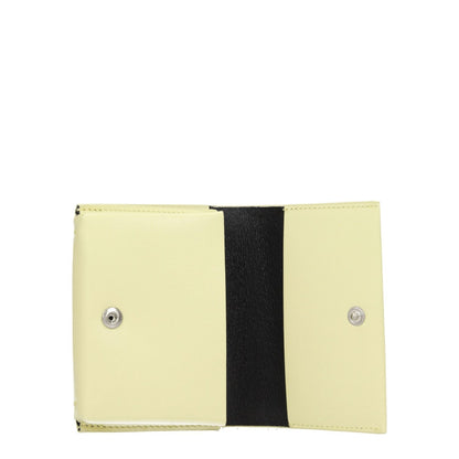 Open view of Jil Sander Yellow Leather Cardholder with button closure and three card slots. Measurements: 7.5×10 cm. Secondary color: Lemon.