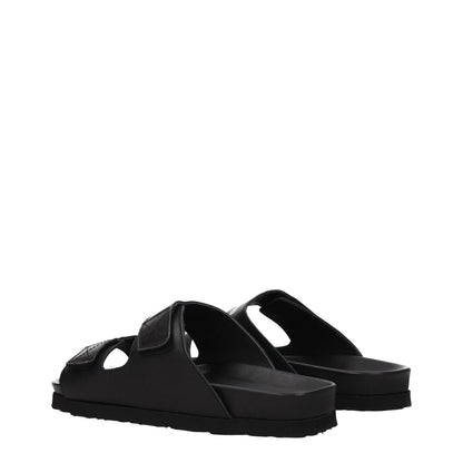 Palm Angels Black Leather Slippers with strap closure and open toe design, featuring a rubber sole and low flat heel, casual style.