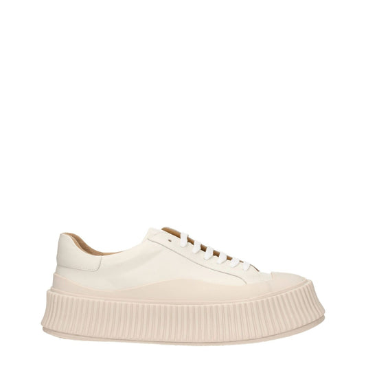 Jil Sander Beige Leather Platform Sneakers with round toe, lace-up closure, and wedge heel, featuring a rubber sole and aged effect design.