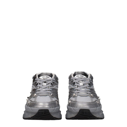 Valentino Garavani Gray Fabric Athletic Sneakers featuring studs, logo, and lace-up closure with round toe and rubber sole.