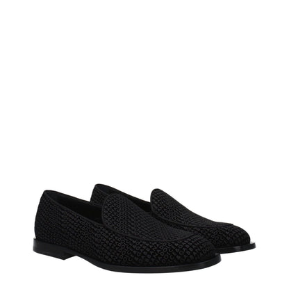 Dolce & Gabbana Black Velvet Slip-On Loafers with logo, low flat heel, round toe, and leather sole in stylish design.
