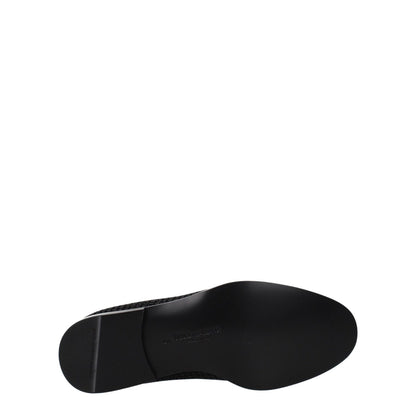 Sole view of Dolce & Gabbana Black Velvet Slip-On Loafers with leather sole and round toe design.