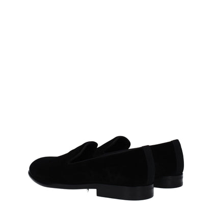 Dolce & Gabbana Black Velvet Slip-On Loafers with round toe and leather sole, viewed from the side.