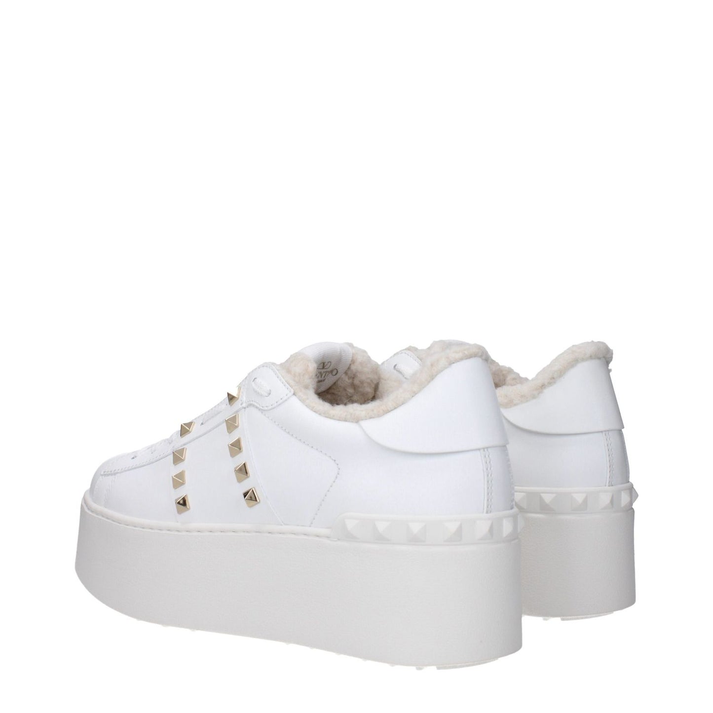 Valentino Garavani White Leather Platform Sneakers with studs, front logo, and fur inside, featuring a wedge heel and round toe.