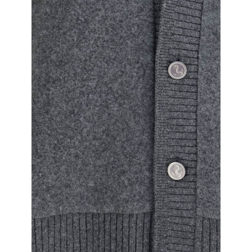 Close-up of Thom Browne Gray Wool Cardigan showing button detail and ribbed hem.