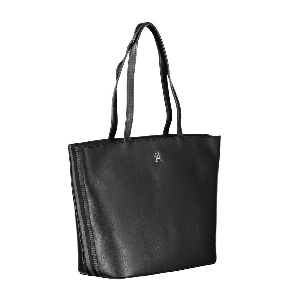Front view with bag zipped and handles upright.
