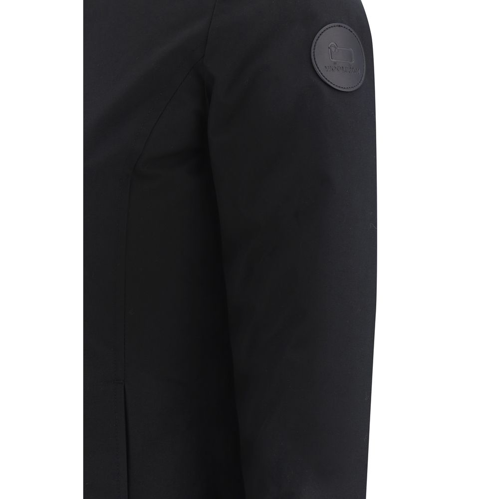 Close-up of Woolrich Black Nylon Parka with iconic logo patch, highlighting the sleek design and quality fabric.