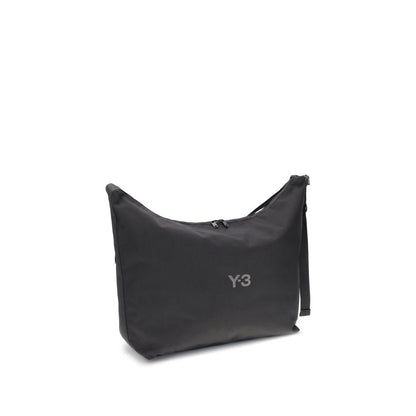 Alt Tag: Y-3 Black Polyamide Shoulder Bag with logo, adjustable strap, and zip closure, minimal style.