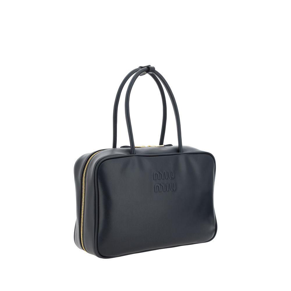 Front view with bag zipped and handles upright.