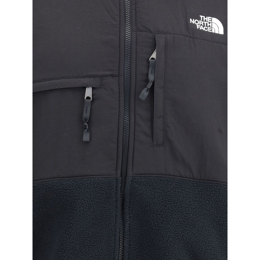 The North Face Black Polyamide Shell Jacket with zipper closure and logo detail, featuring front pockets and high collar for comfort and style.