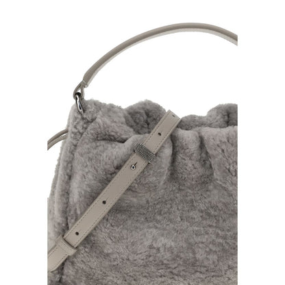 Close-up of Brunello Cucinelli Gray Fur Shoulder Bag with leather strap and drawstring closure, showcasing soft shearling texture.