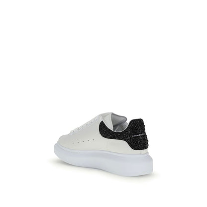 Alexander McQueen White Leather Chunky Sneakers with black crystal heel detail and thick sole, showcasing contemporary style.